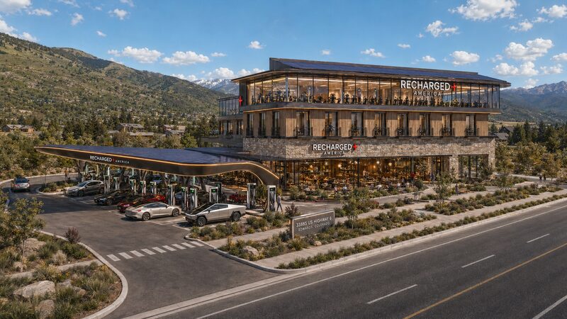 Recharged+ America Edwards Stone Yard exterior in daylight, with the EV charging canopy and mountain backdrop