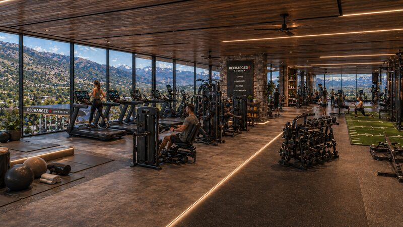 Recharged+ America Edwards mountain-view fitness club with treadmills, strength equipment, and panoramic windows facing the Rockies